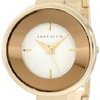 7533_anne-klein-women-s-ak-1082wtgb-gold-tone-curved-bangle-watch.jpg